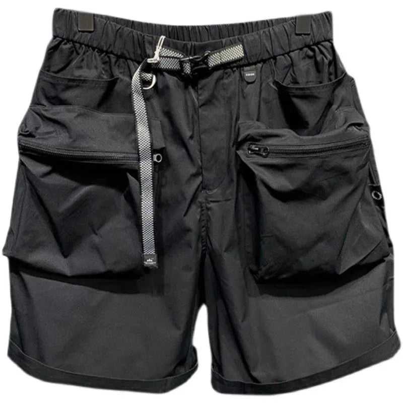 Men's loose fit grey workwear shorts with pockets, shown above the knee.