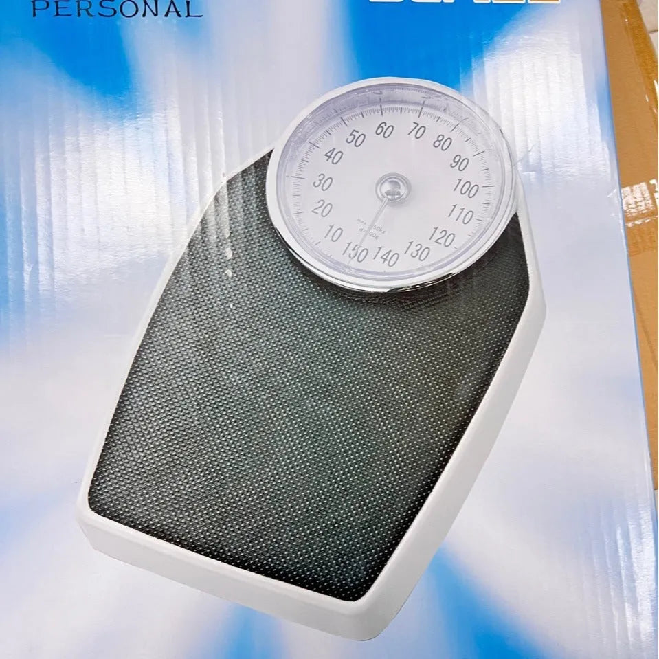 Black mechanical bathroom scale with large analogue dial on 47x35cm platform.