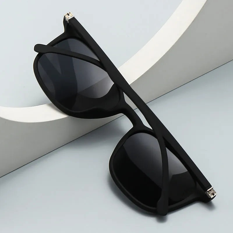 Men's polarised sunglasses with PC frame showing multiple colour options including black and blue frames