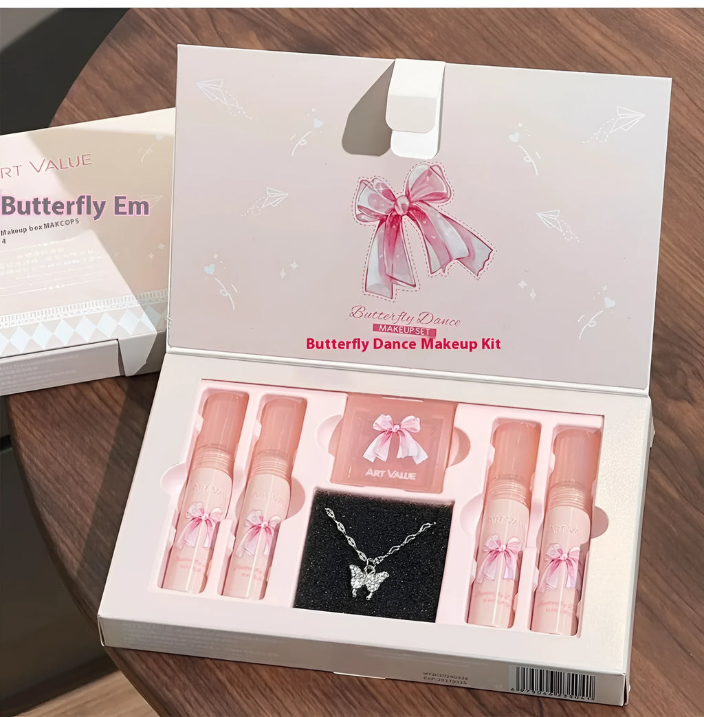 Butterfly Box makeup set containing four pink matte lip muds, one powder blusher, and a butterfly necklace in standard packaging.