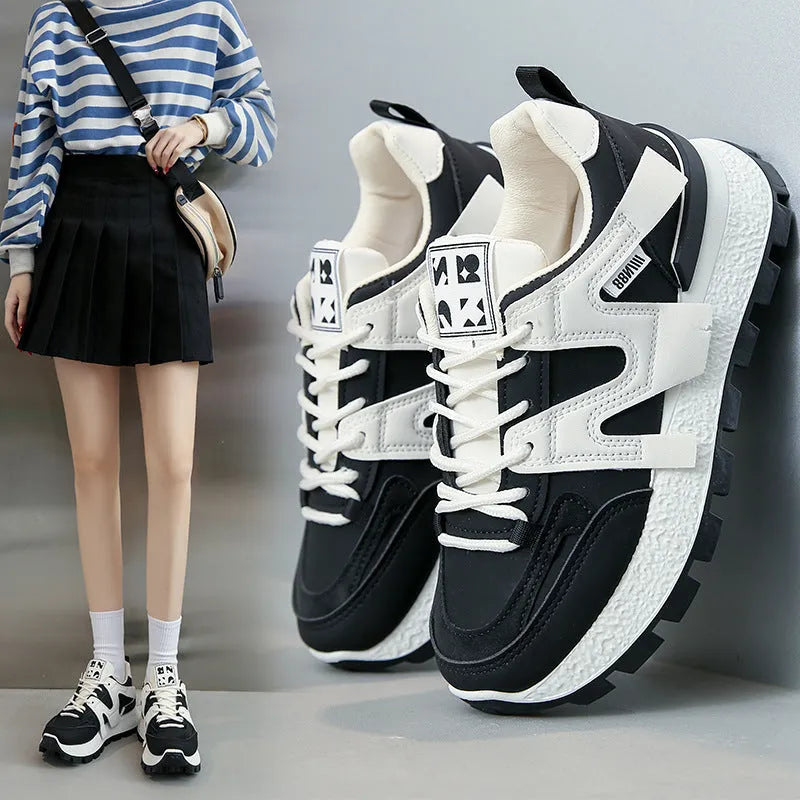 Low-top white running sneakers with round toe and front lace-up design on rubber sole