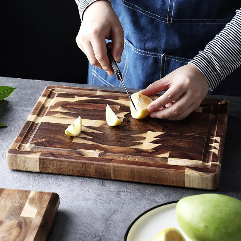 Brown solid acacia wood chopping board, 3cm thick, on a kitchen countertop.