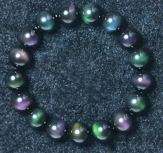 Rainbow eye obsidian bracelet with green, purple and gold colour eye beads in 8mm to 20mm sizes