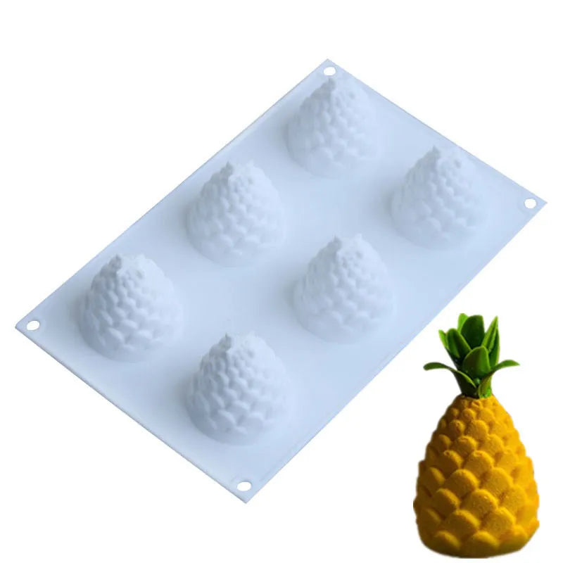 Set of six silicone baking moulds showing pineapple, pine cone and pear shapes for dessert making
