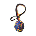 Floating EVA pet training ball with attached string in camouflage or yellow colour