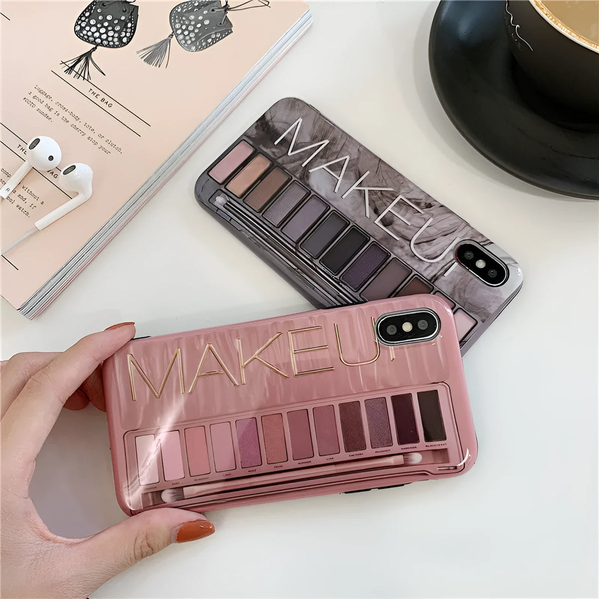 Grey silicone iPhone case with a blended eye shadow pattern design on the back.