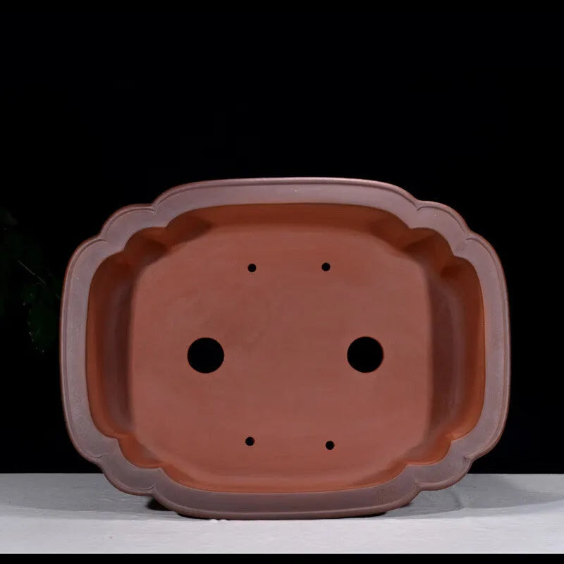 Large antique-finish Chinese purple clay flower pot with decorative tree stump and floral motifs.