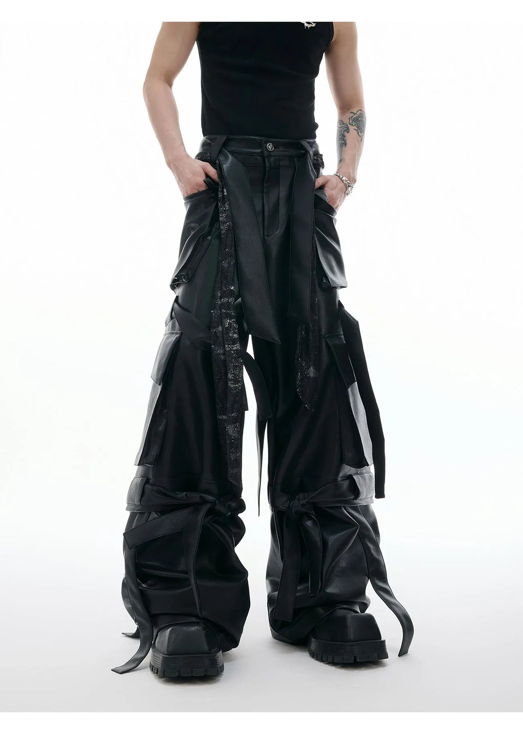 Black loose-fit retro trousers with quilted stitching pattern, multiple pockets, and ribbon trim detail.