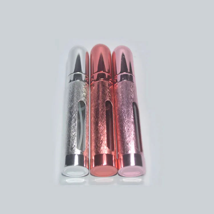 12ml aluminium portable perfume bottle in bullet shape with glass liner, shown in various colours.