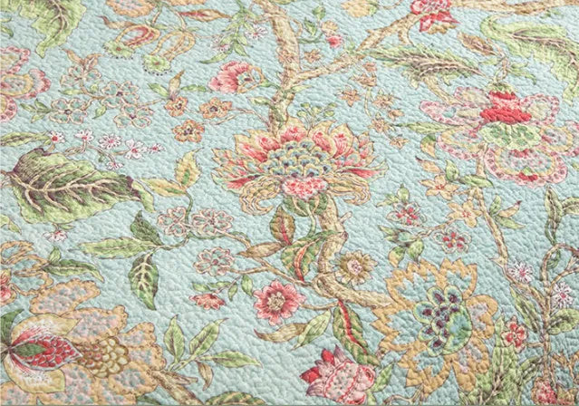 Blue American floral pattern cotton bedspread set with quilted texture, three-piece bedding displayed on bed