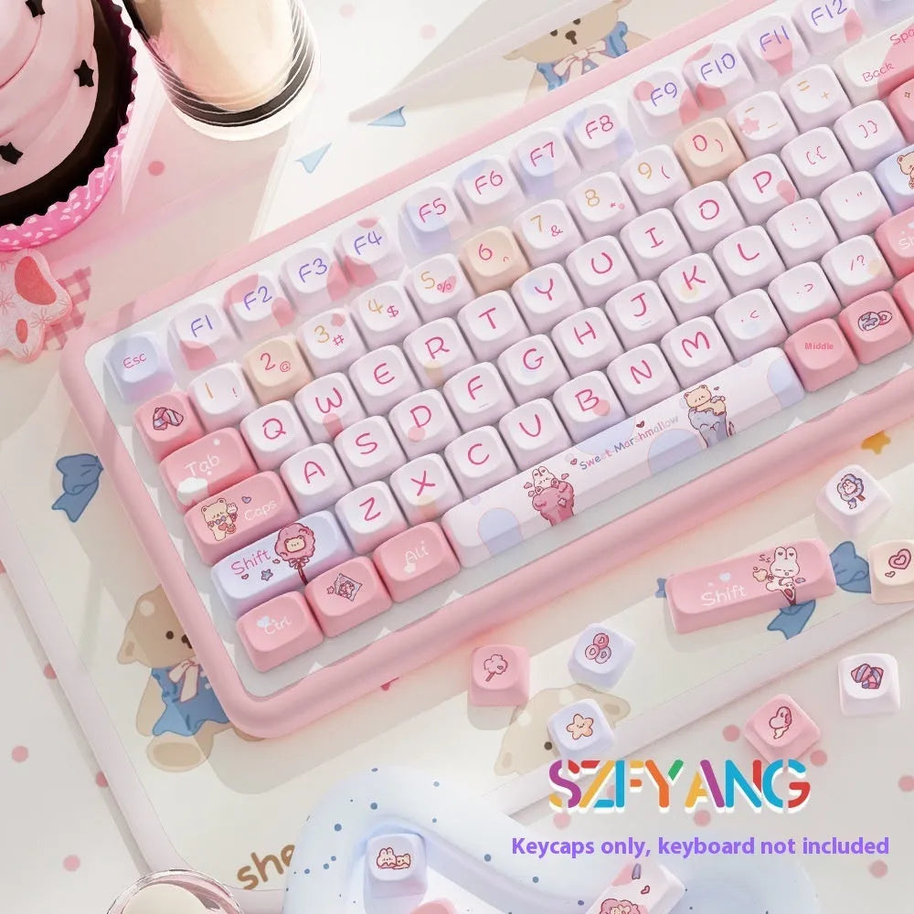 Sweet cotton candy coloured PBT pudding keycaps for mechanical keyboards on a desk