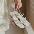 Women's flat beige Roman sandals with square toe and microfiber straps