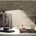 Black and white 4-in-1 LED desk lamp with wireless charging base and USB-C port
