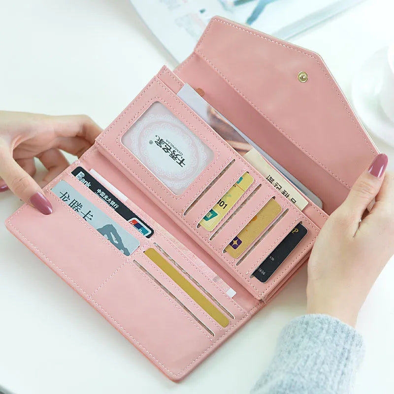 Three-fold women's leather wallet with buckle clip closure in five colour options showing dimensions