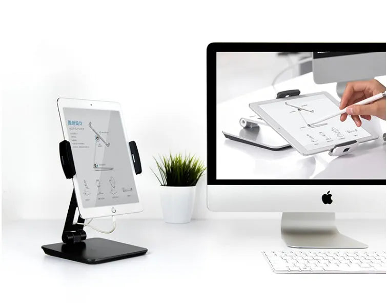 Silver foldable aluminium tablet phone holder showing 360-degree rotation mechanism and silicone anti-slip pads