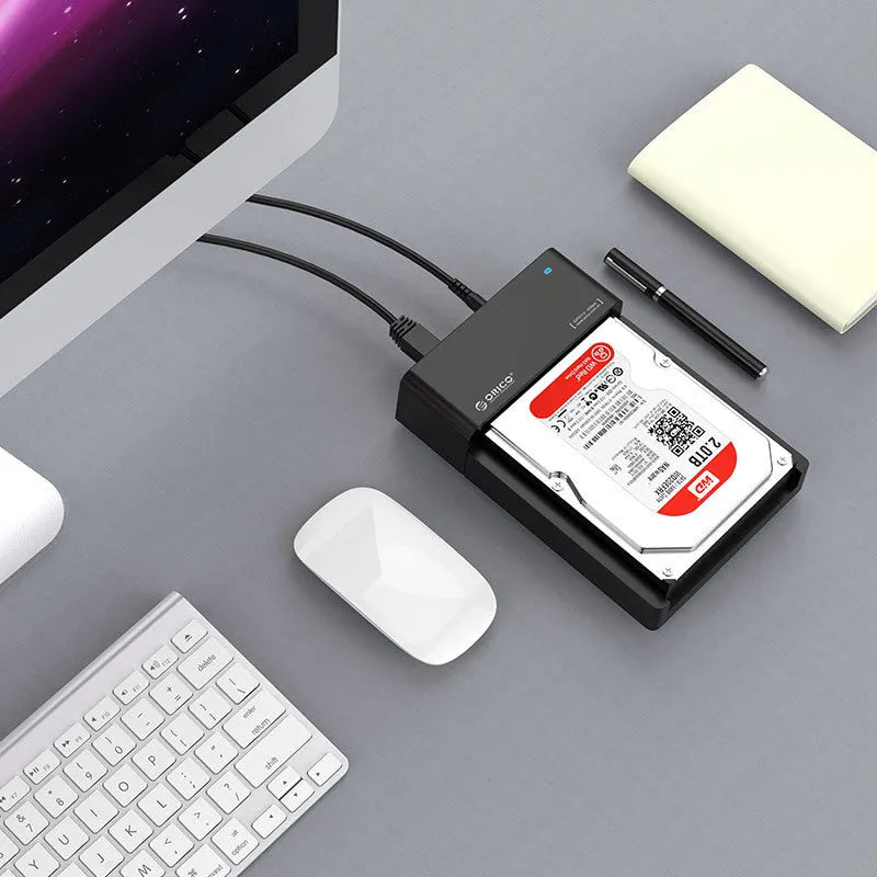 Black plastic 2.5-inch SATA hard disk enclosure with USB cable