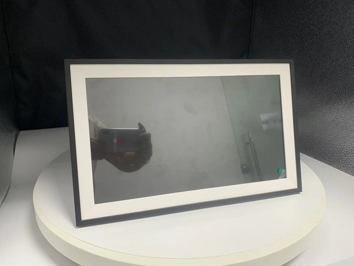 White 15.6 inch smart digital photo frame with Full HD screen on a table