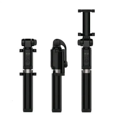 Bluetooth selfie stick tripod with remote control extended with smartphone attached