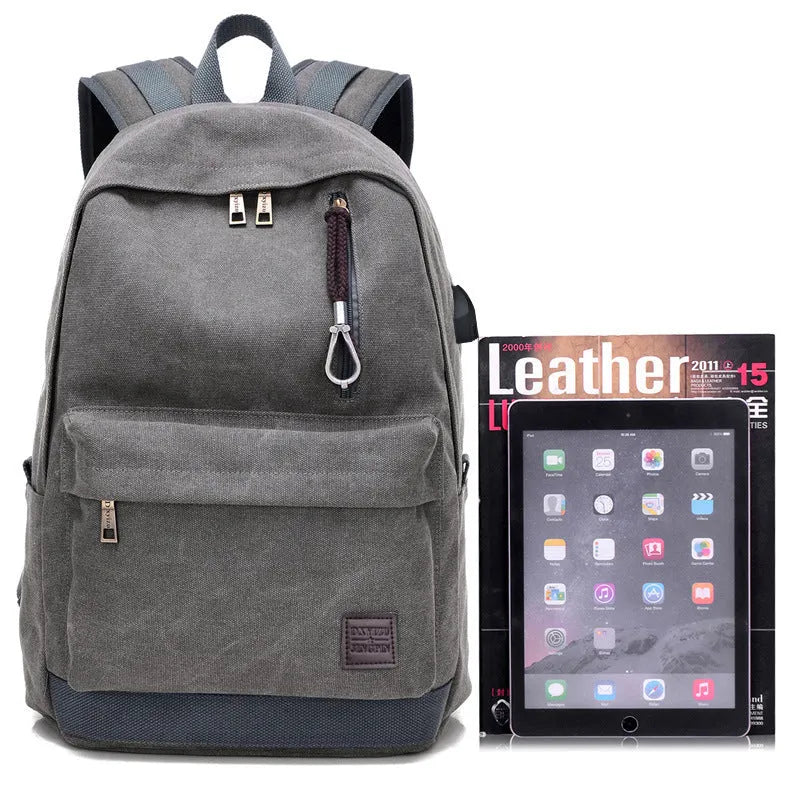Canvas USB charging backpack in khaki colour showing front compartment and USB port.