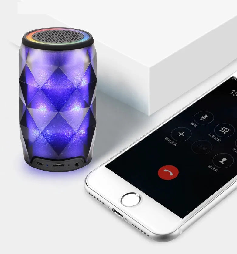Black crystal Coca-Cola can lantern speaker with diamond-cut design and colourful starry sky lighting effect.