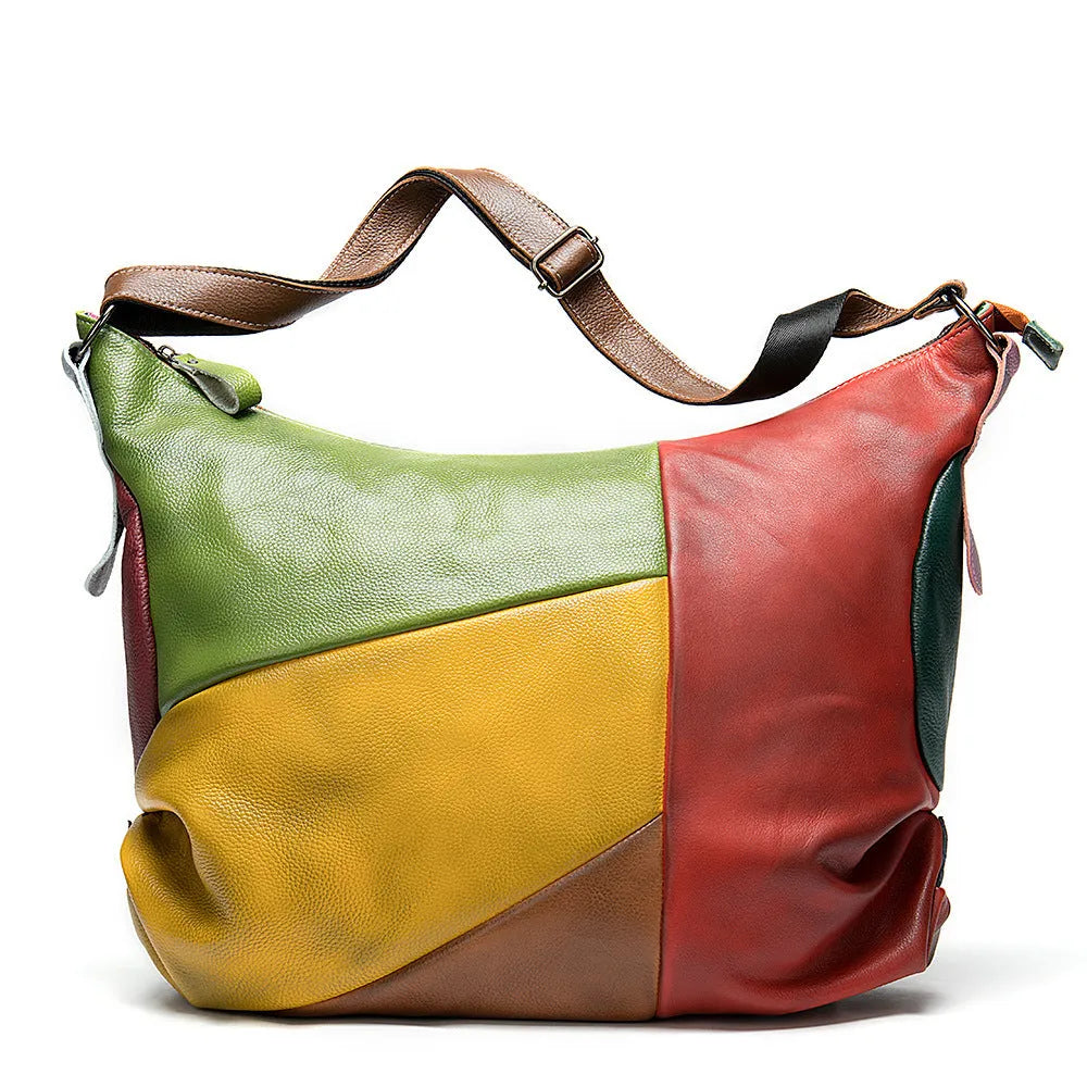 Brown cowhide leather crossbody bag with stitching rubbing texture, shown holding a laptop and A4 magazine.