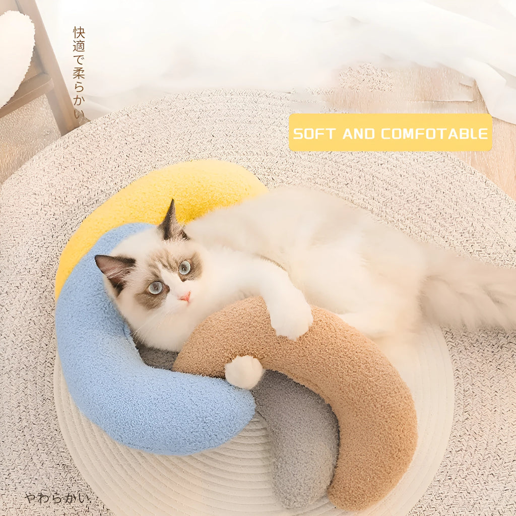U-shaped blue cat pillow with adjustable cervical collar on white background