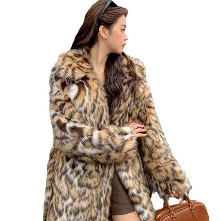 Long faux fur coat with fox print design, fur collar, and pockets in a street fashion style.