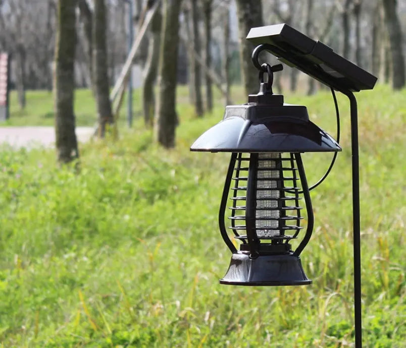 White solar mosquito lamp with purple switch, solar panel top, and LED insect attraction beads for garden outdoor use