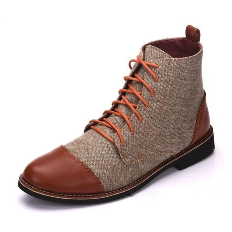 A pair of large leather boots for men with belt buckle detail and a rubber sole.