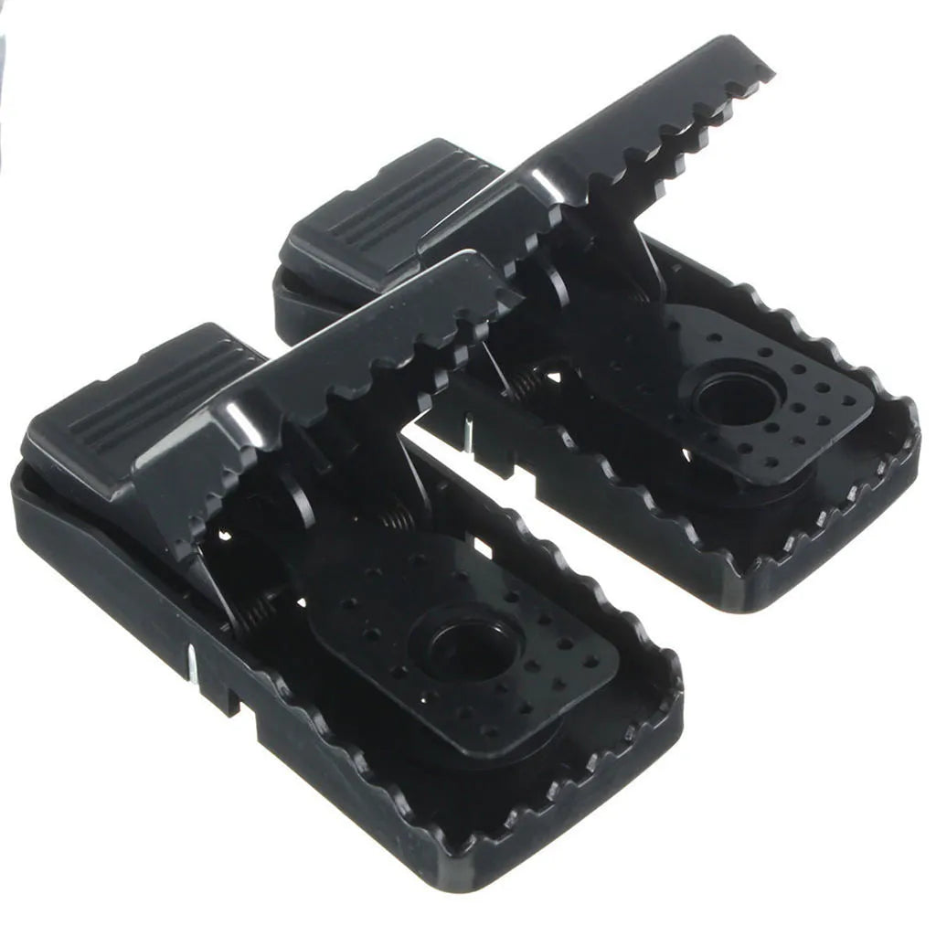Six black snapping mousetraps showing PC+ABS alloy plastic construction and biting mechanism