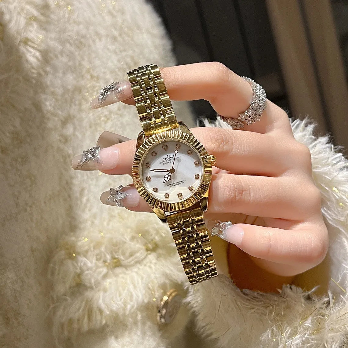 Women's rose shell dial watch with 7mm slim case, shown with leather or steel strap options