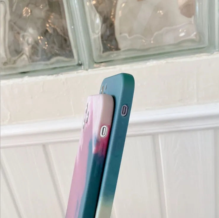 Soft silicone phone case with oil painting gradient geometry abstract design in blue, green, pink, or purple for iPhone.