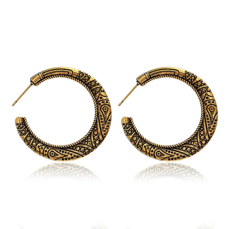 C-shaped alloy earrings with vintage engraving pattern in bronze colour showing curved design and butterfly clasp