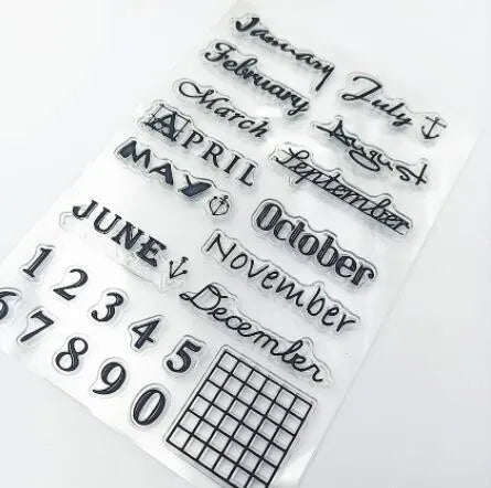 Close-up of a transparent silicone vintage calendar and digital table icon stamp on a white background.