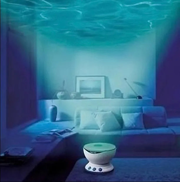 Blue stationary ocean projection lamp with DLP technology on a surface.