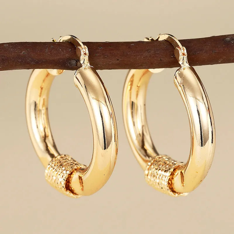 Geometric copper women's earrings with ring ear clip design in golden colour