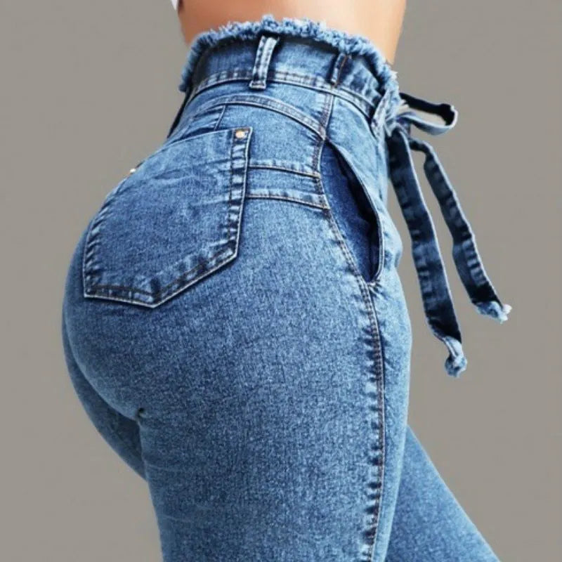 Women's fringed jeans with distressed hem in grey, dark blue, and light blue colours, showing five-pocket design and loose fit