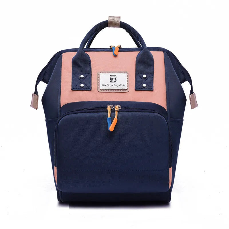 Large capacity mummy maternity nappy bag backpack in nylon with 16 pockets, 20-35L capacity, and aluminium foil insulated section