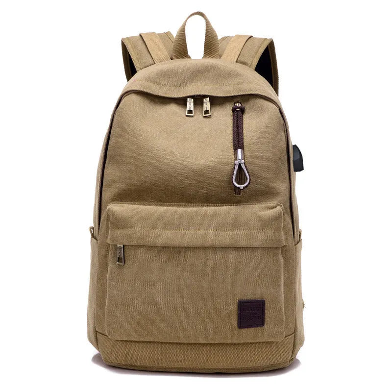 Canvas USB charging backpack in khaki colour showing front compartment and USB port.