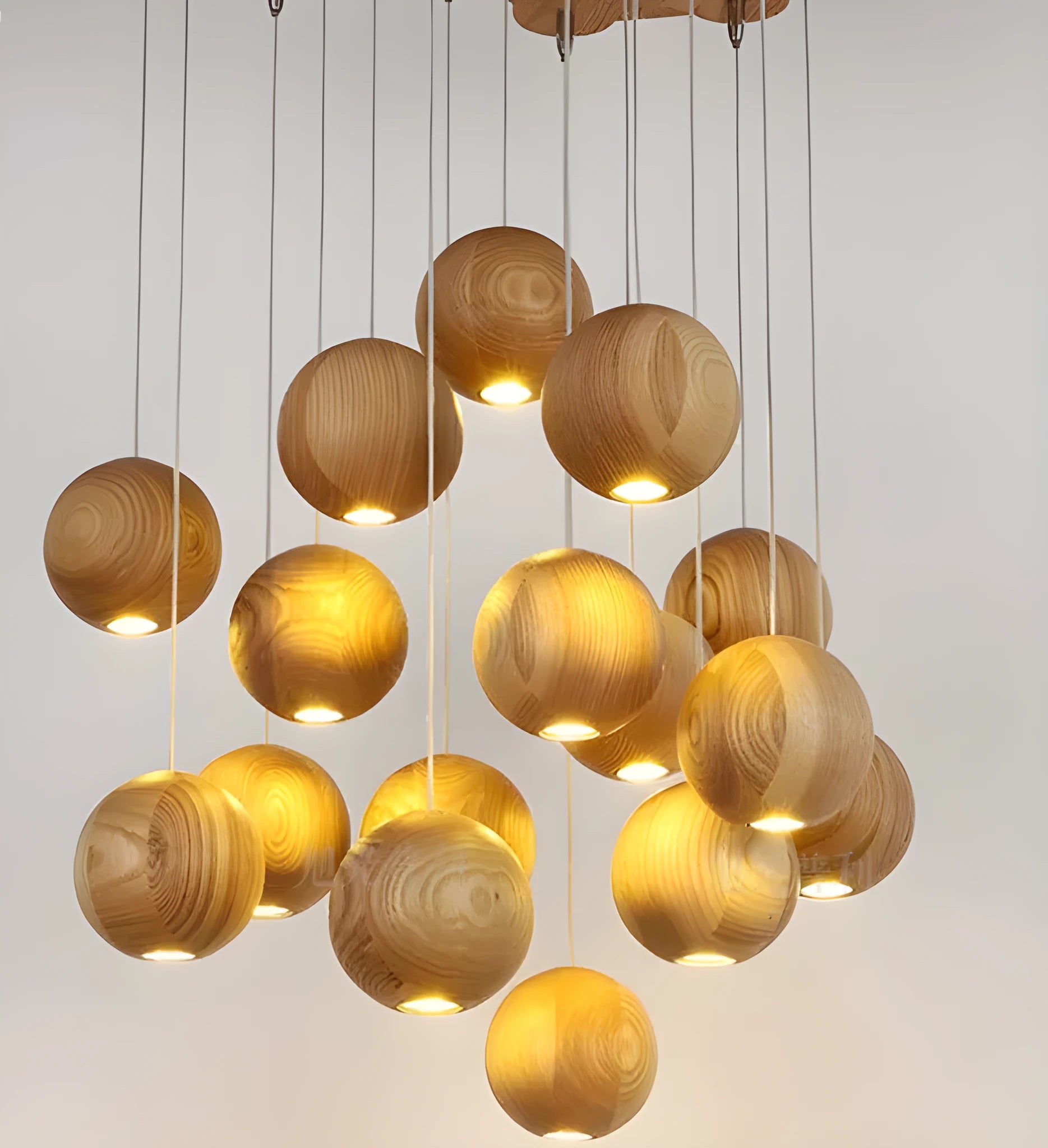 Nordic style solid wood ball chandelier hanging from ceiling with adjustable cord