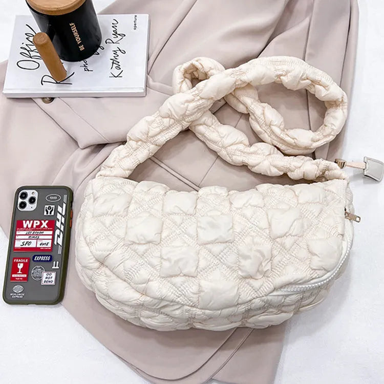 Women's solid colour nylon messenger bag with adjustable shoulder strap.