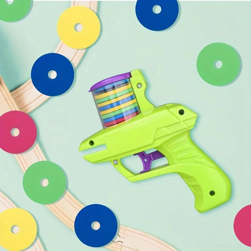 Green interactive battery-free cat toy launcher with foam disc on a floor.