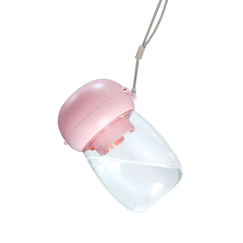Foldable 300ml plastic pet drinking cup in mushroom design, shown for cats and dogs outdoors