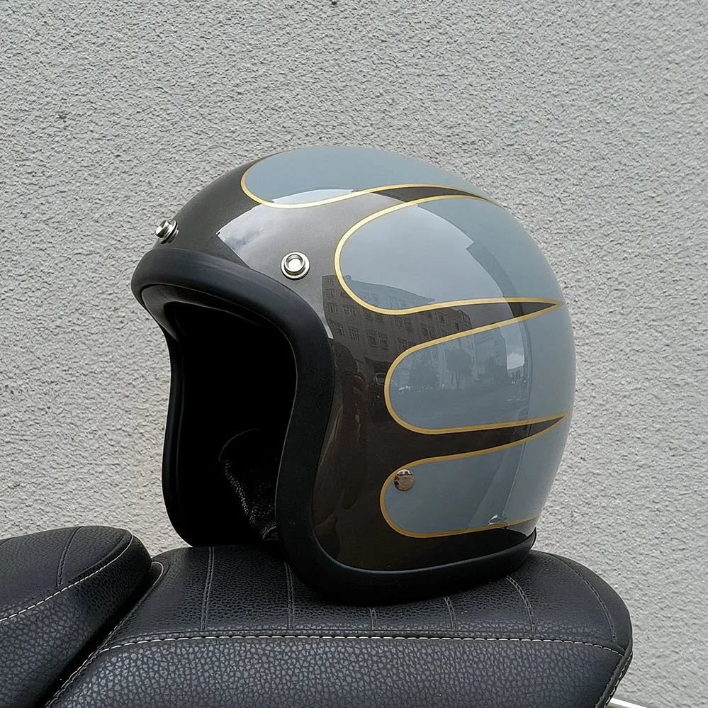 Retro-style half-shell motorcycle helmet in fibreglass, shown in a cement grey colour option.