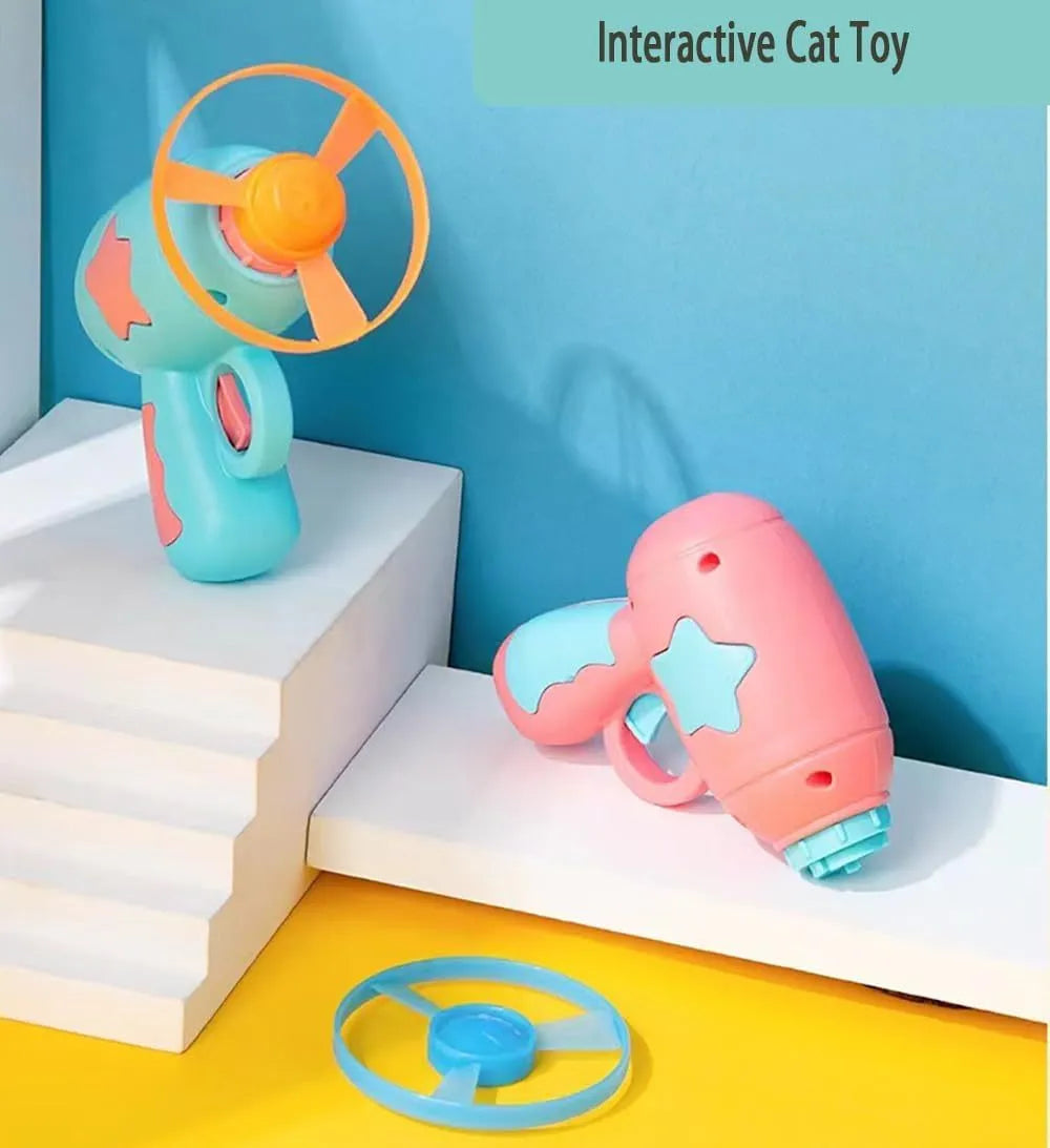 Blue plastic cat toy gun with spinning mechanism and flying disc for indoor feline play