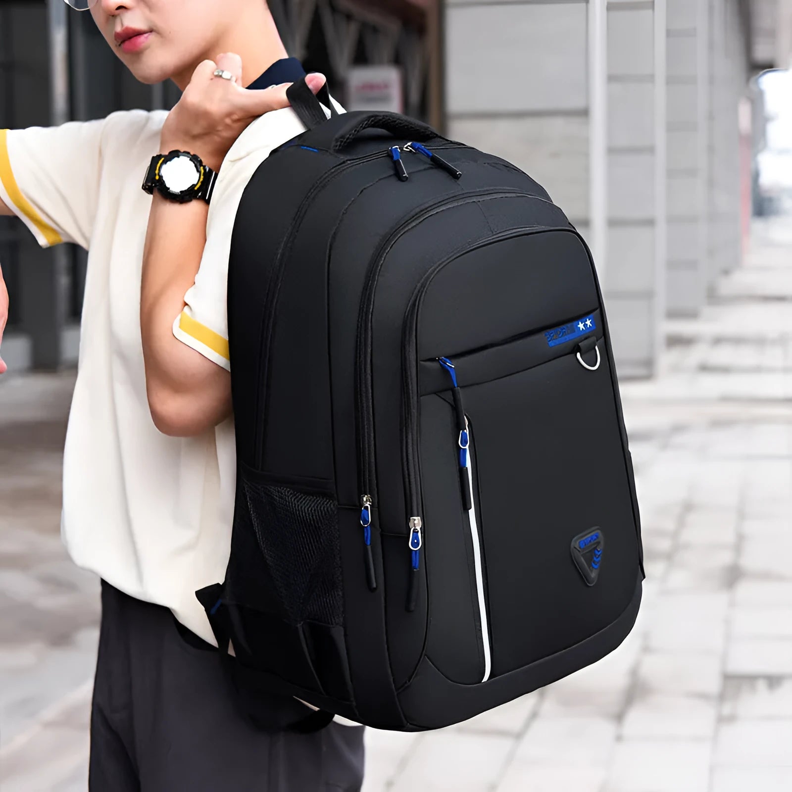 Men's Oxford cloth schoolbag in black with letter pattern, showing large capacity and air pillow straps