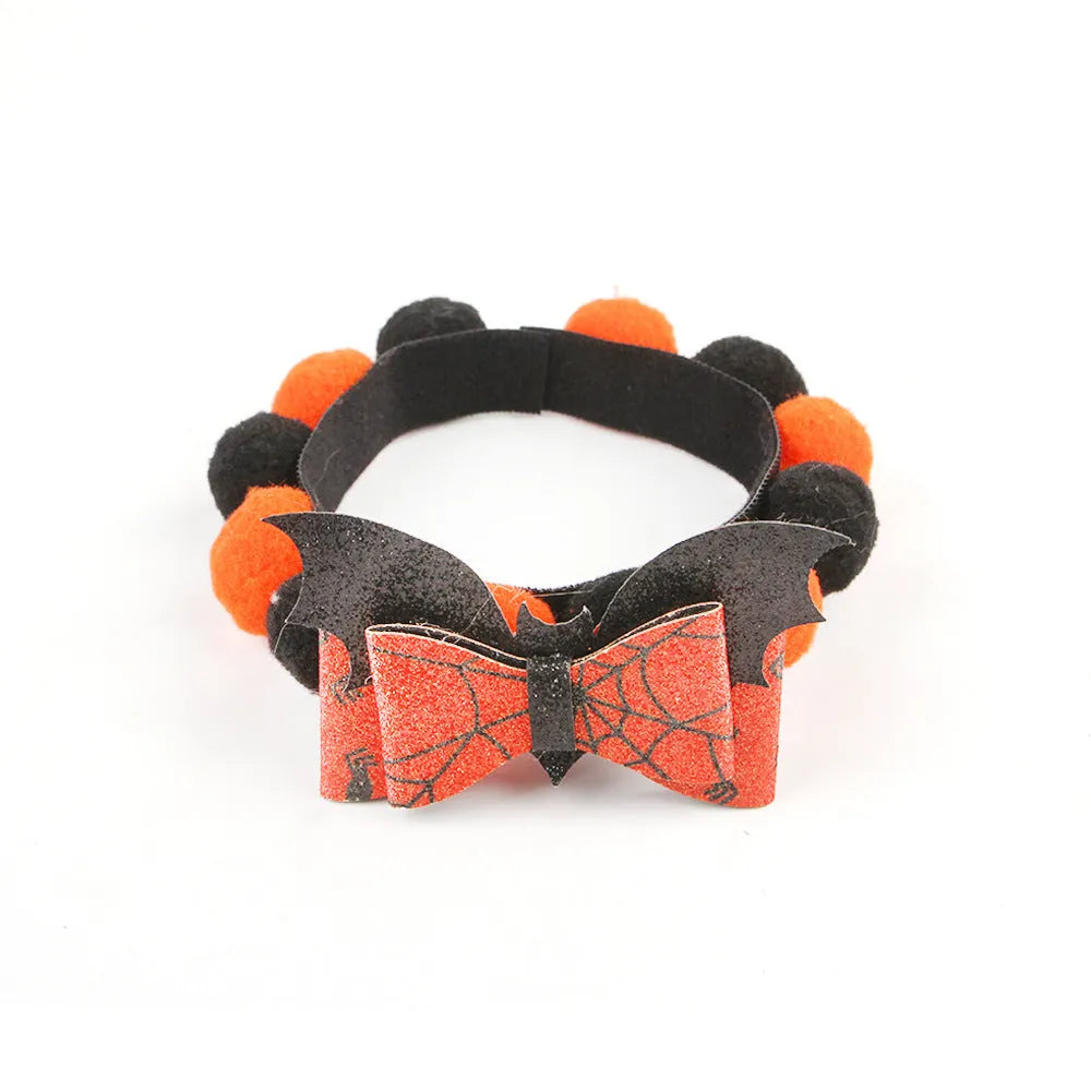 Halloween pet collar with decorative fur ball in pumpkin, bow, skull, and witch designs