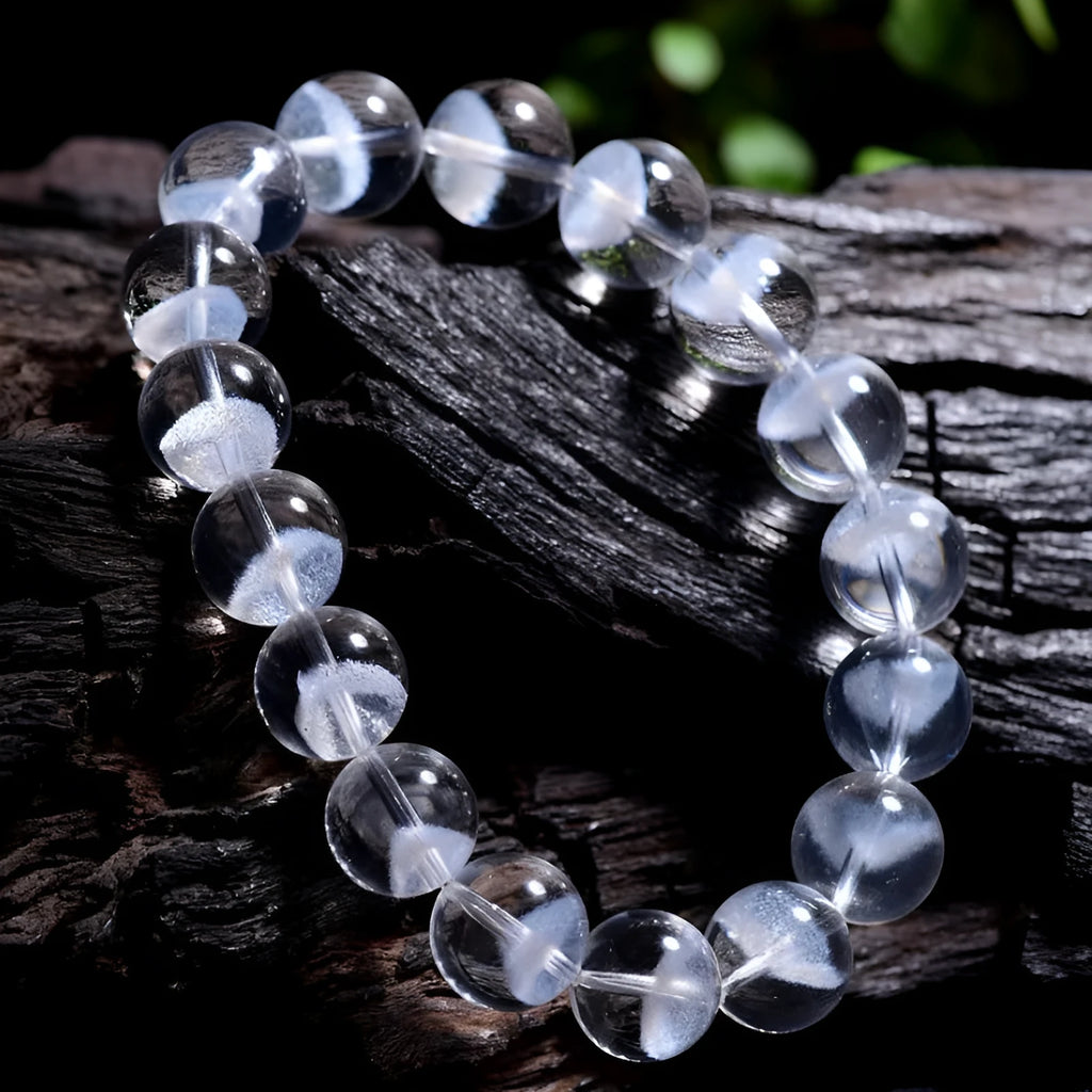 Women's white crystal ghost pyramid bead bracelet with Ruyi symbol design.