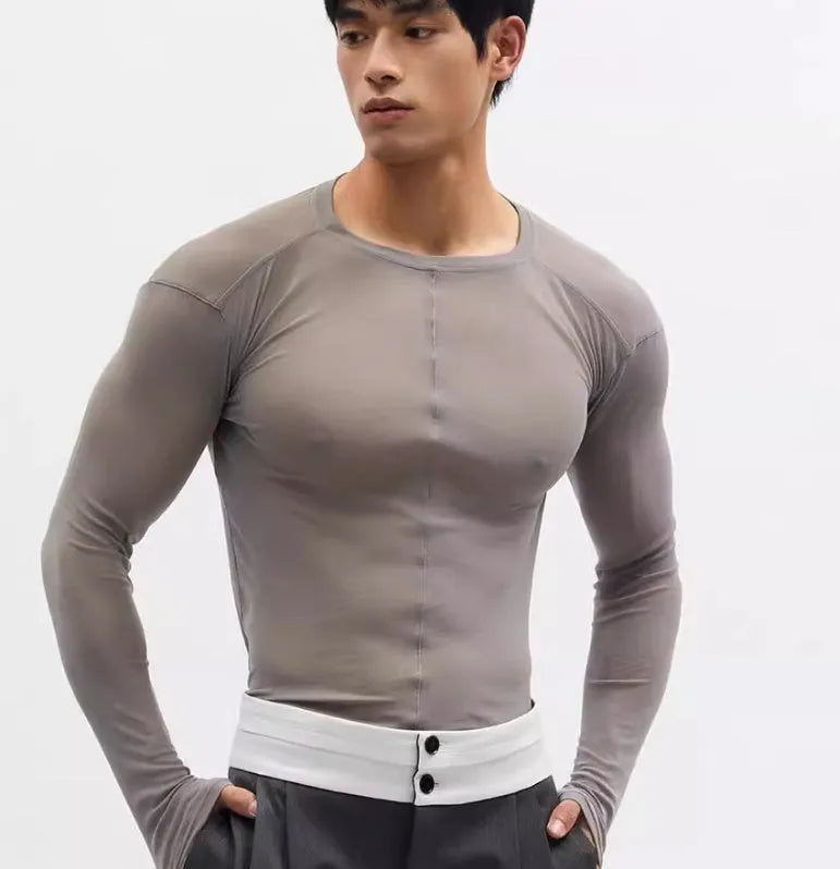 Black mesh see-through slim-fit long sleeve pullover top with round collar on a mannequin.