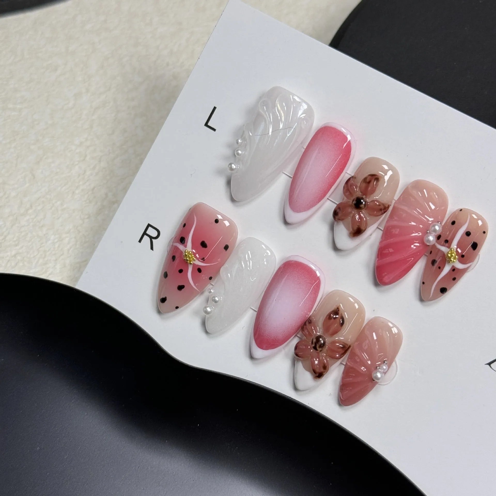 Hand-painted three-dimensional nail art patches with embossed candy patterns in almond shapes